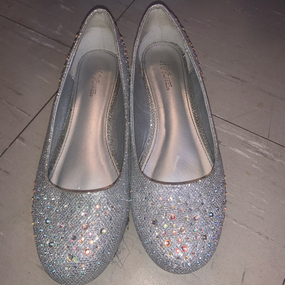A sliver blinged shoe worn once